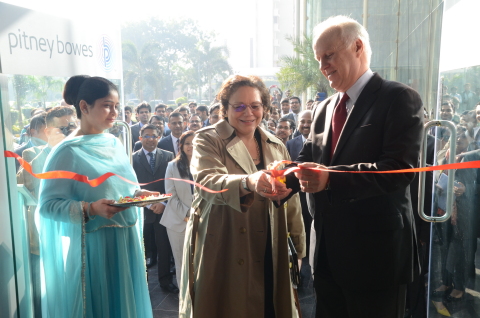 Executive Administrator Abeer Khan assists with the ribbon cutting as Chief Human Resources Officer Johnna Torsone and CEO Marc Lautenbach officially open the new Pitney Bowes office in Gurgaon, India.